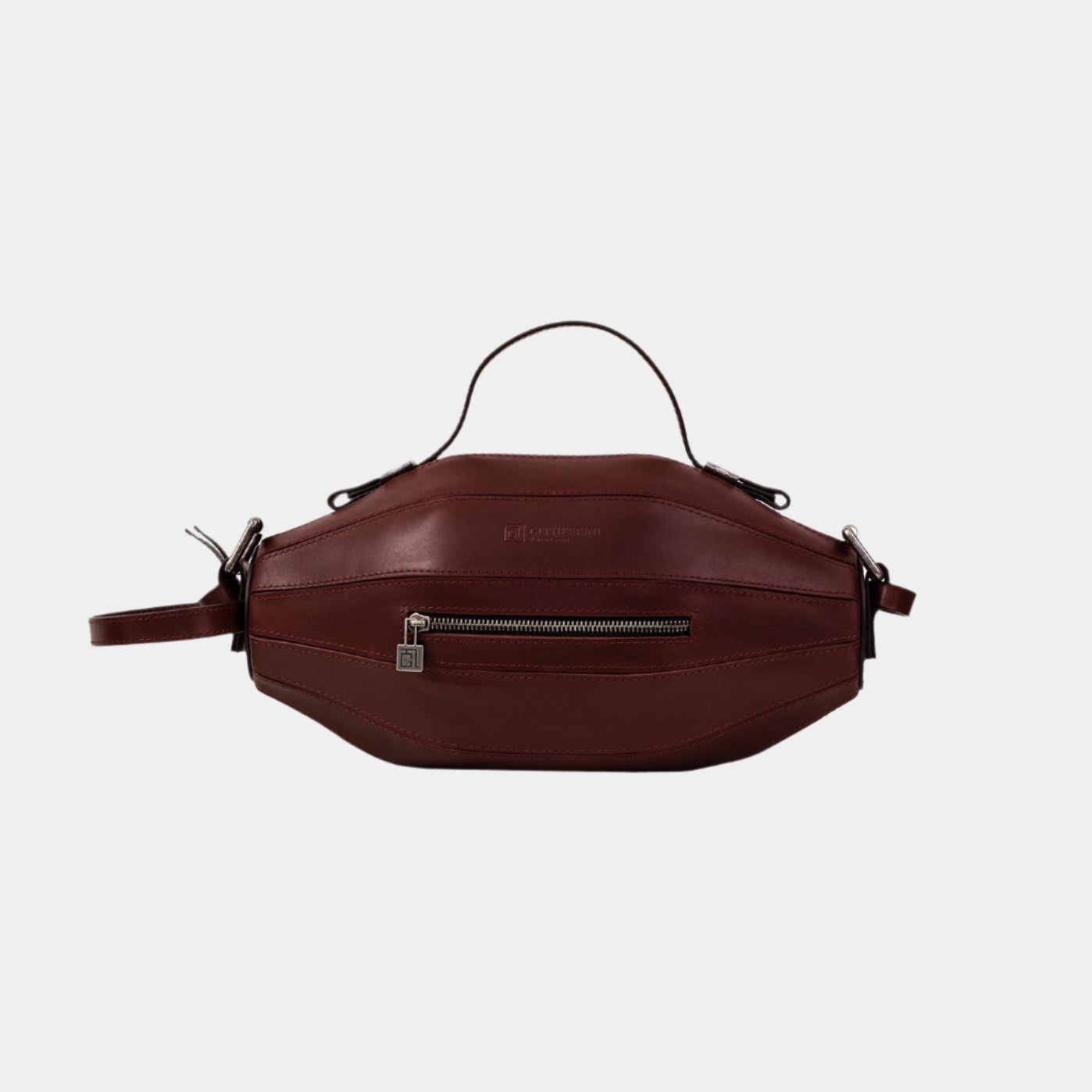 Ellisse Bag in burgundy genuine leather with curved silhouette, front-facing with top handle and zip pocket.