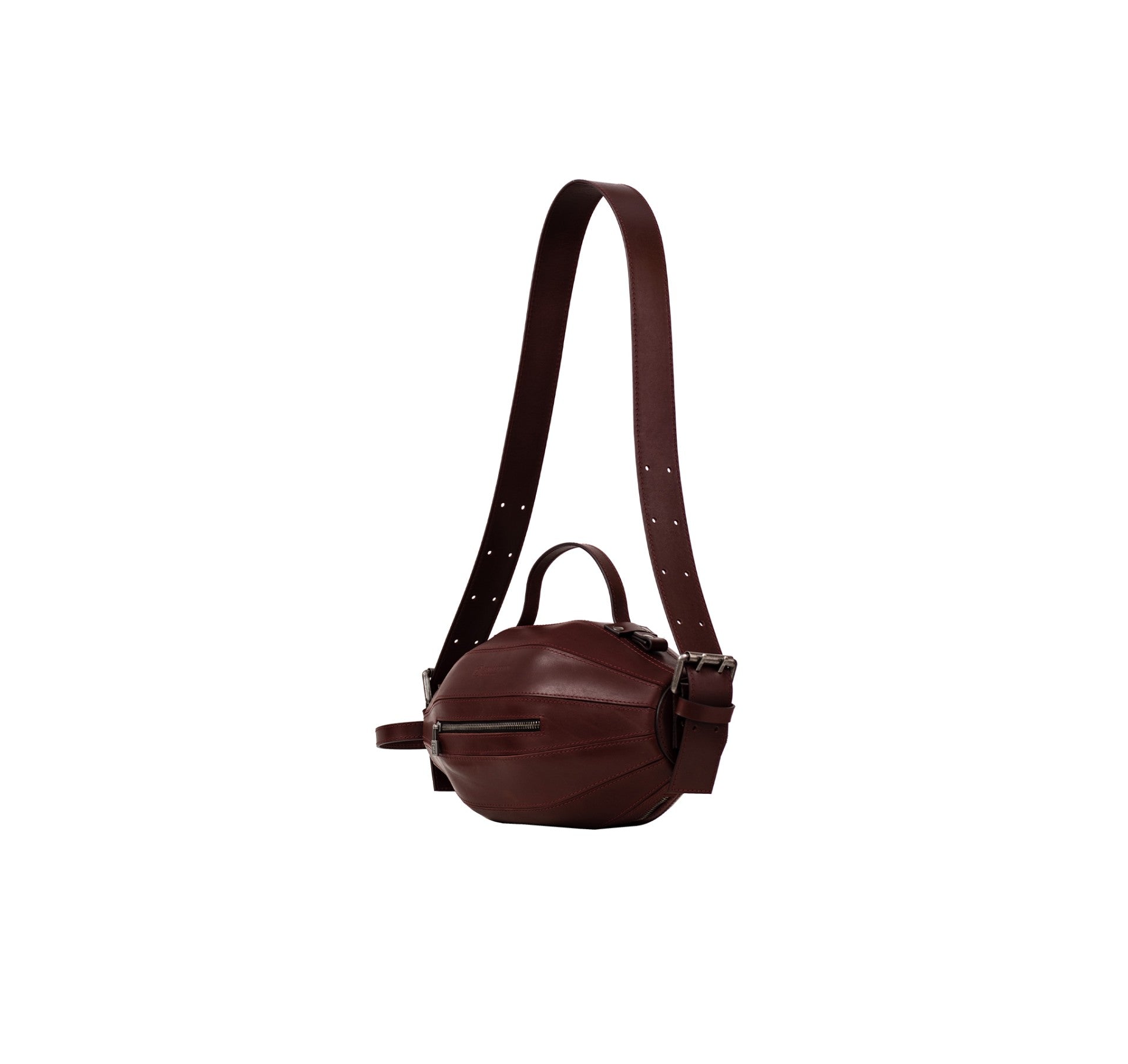 Side profile of the Ellisse Bag revealing its elliptical shape and depth.
