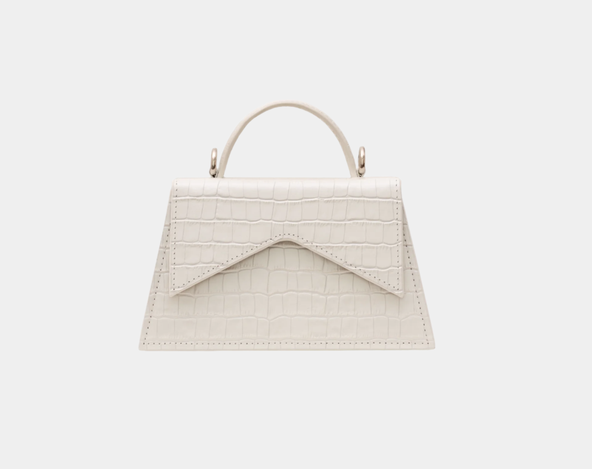 Front view of Evelyn beige trapeze-shaped leather handbag with flap closure