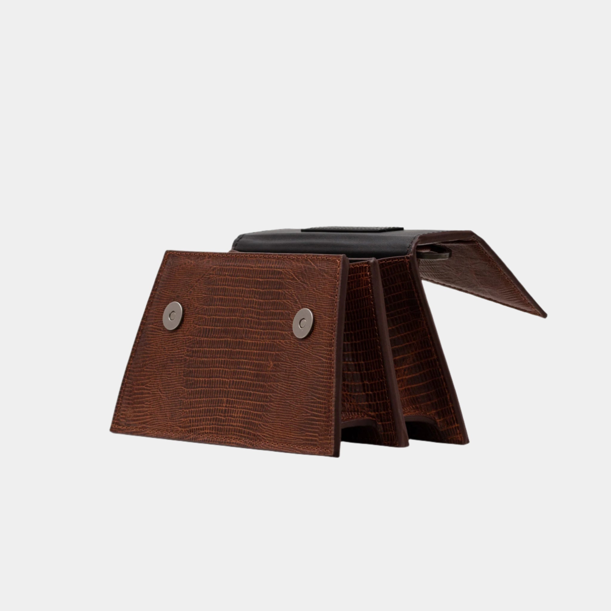 Opened view of Evelyn brown leather handbag revealing interior compartments and flap