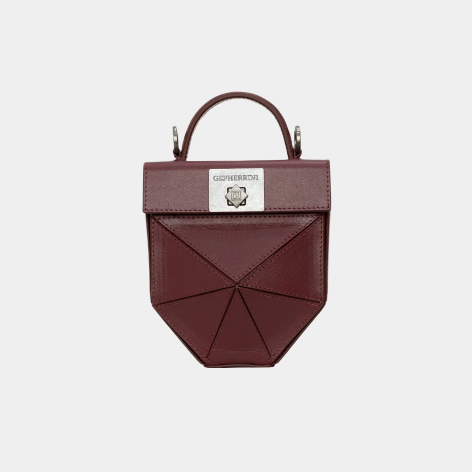 Gepherrini Isla bag in burgundy with sculptural front panel and silver hardware
