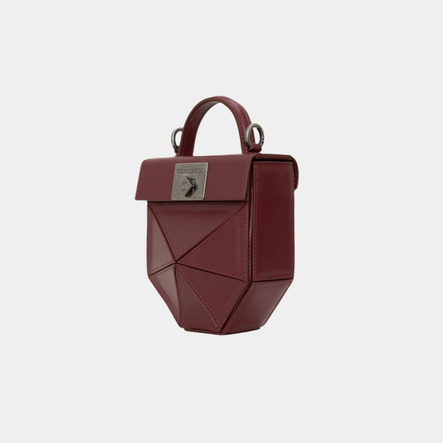 Side angle of burgundy Isla bag with geometric folds and top handle