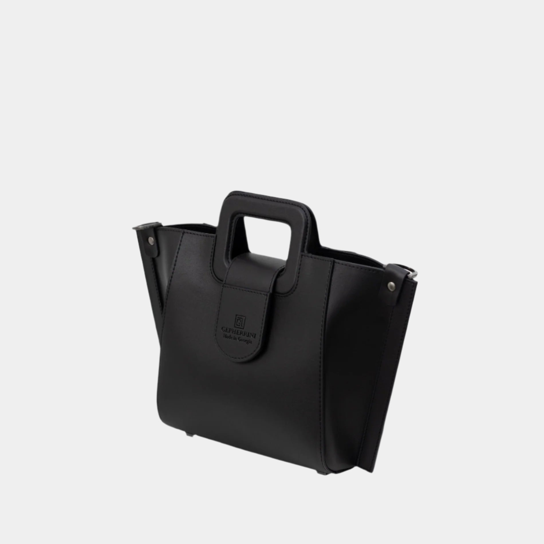Sleek side profile of the Ivea Bag showcasing its sculptural shape and base width.