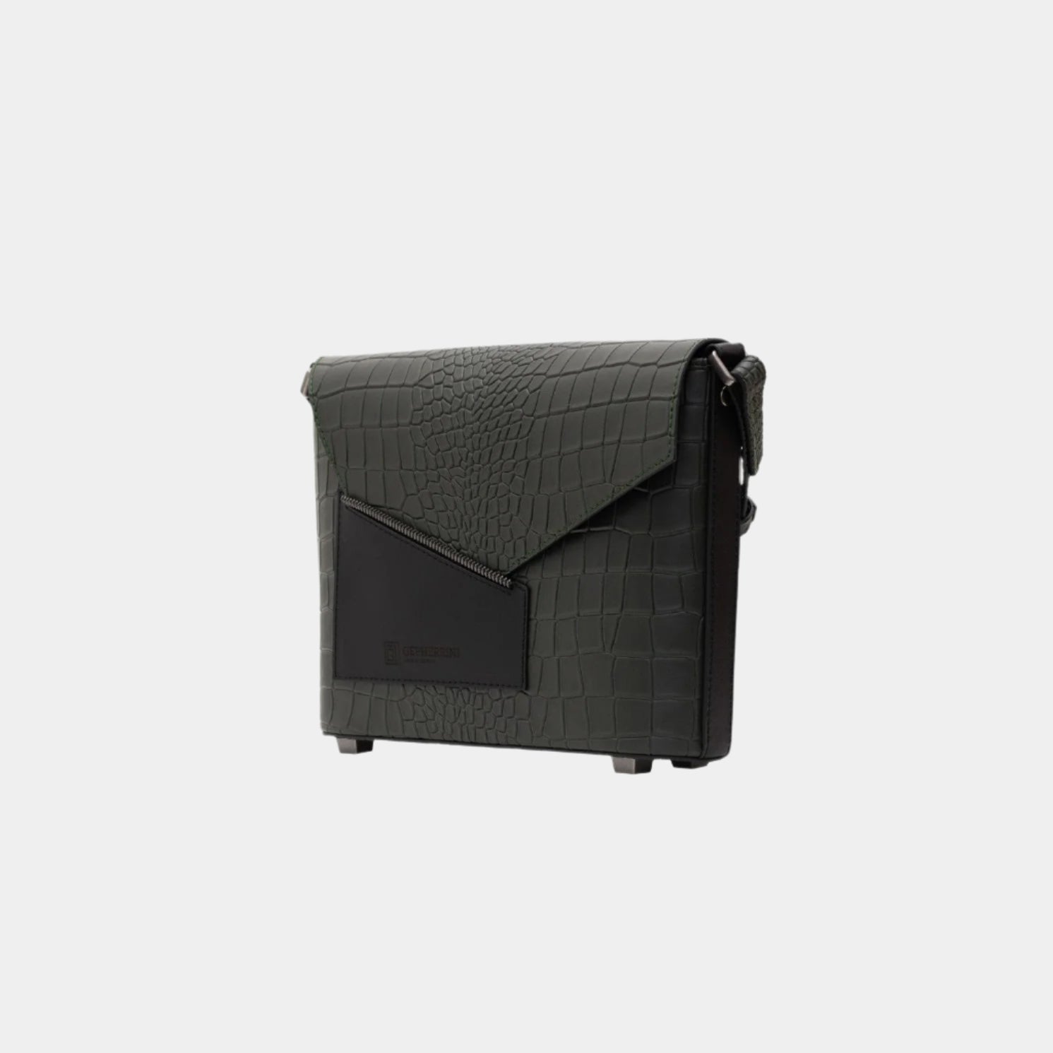 Lita shoulder bag in moss green leather, angled side view showing geometric flap and zip pocket.