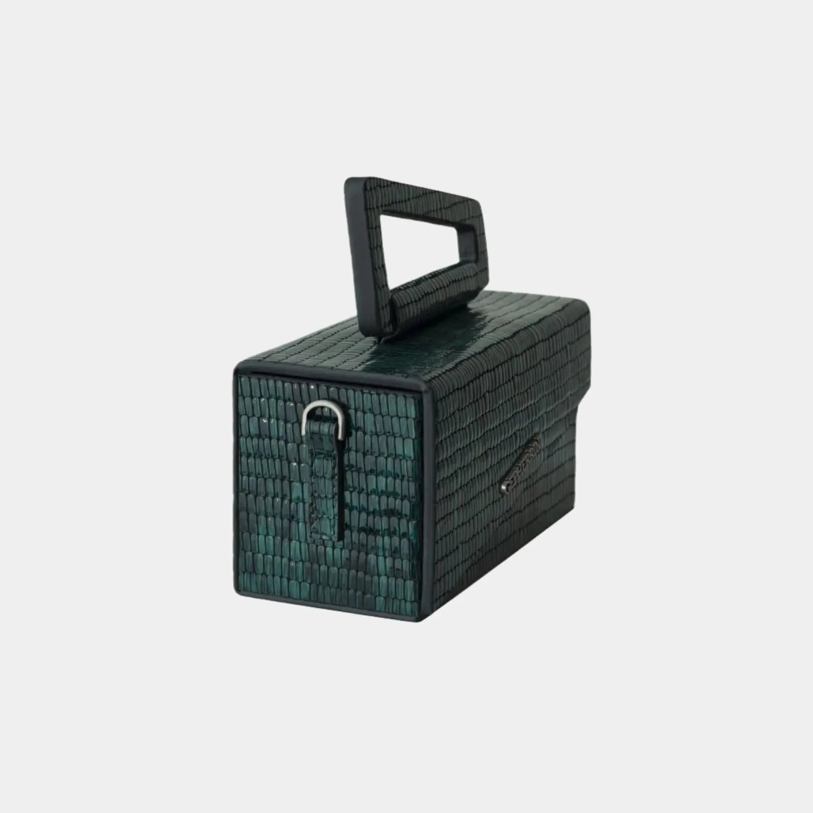 Side angle of Lucia green handbag highlighting sleek structure and top handle detailing