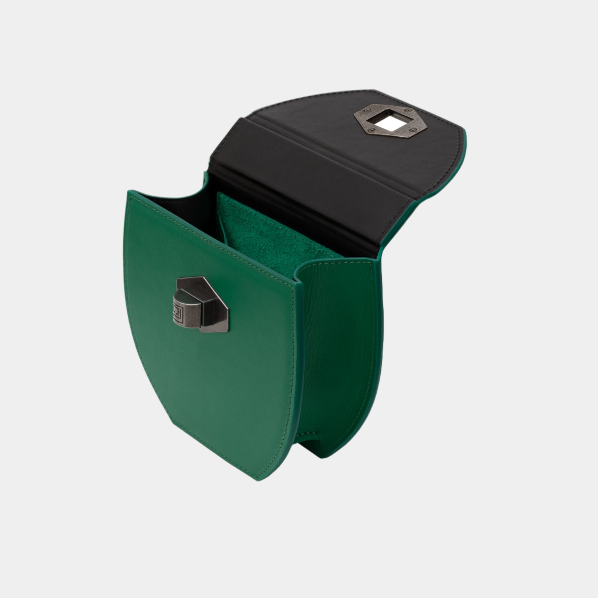 Malisa green handbag opened to show interior space with contrast black flap and soft suede lining