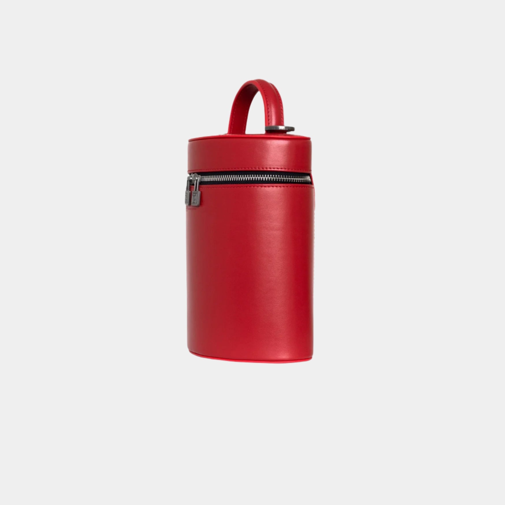 Side profile of Mia red leather handbag with a curved silhouette and sleek zipper closure