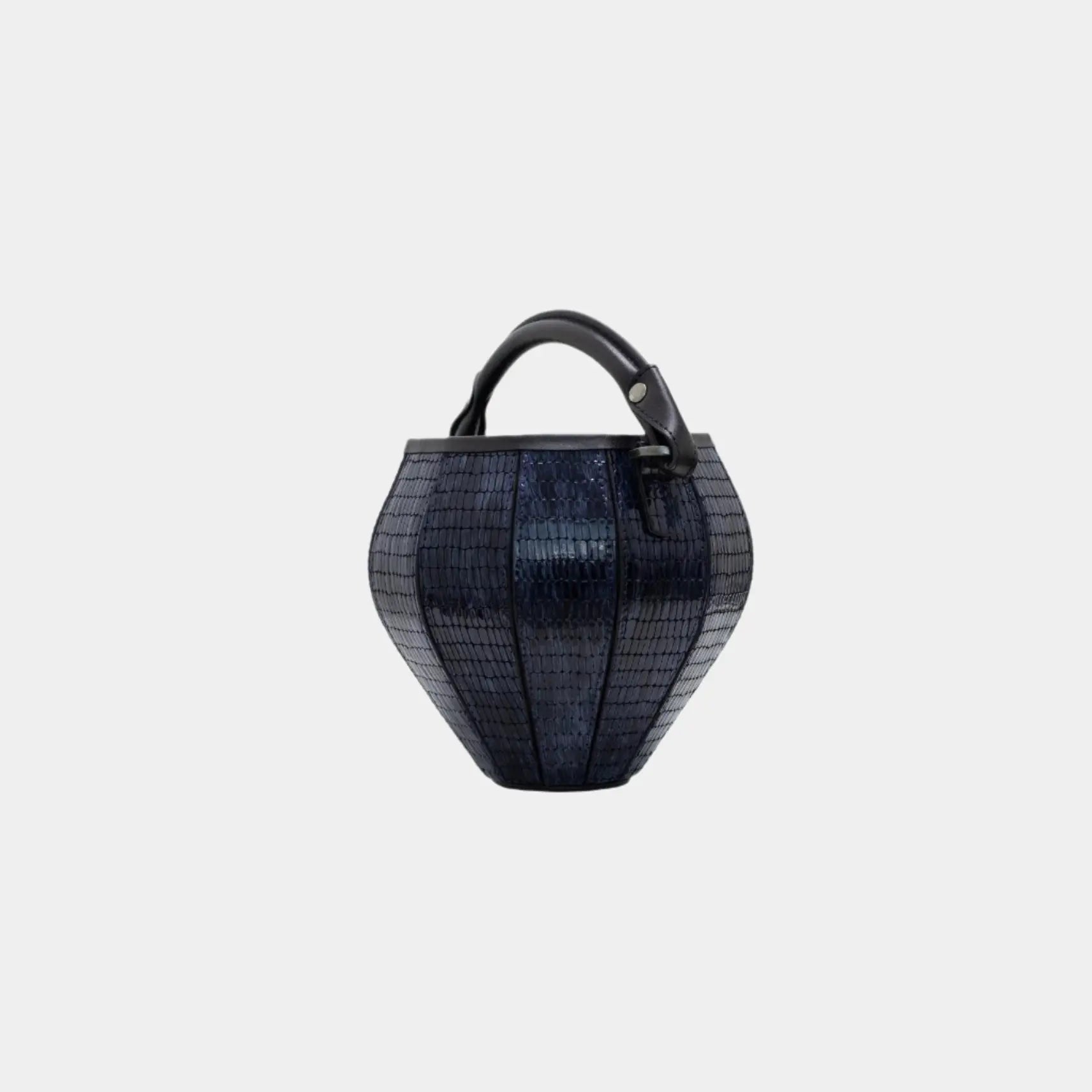 Side profile of Rosa bag showing its sculpted lantern-inspired shape and subtle sheen