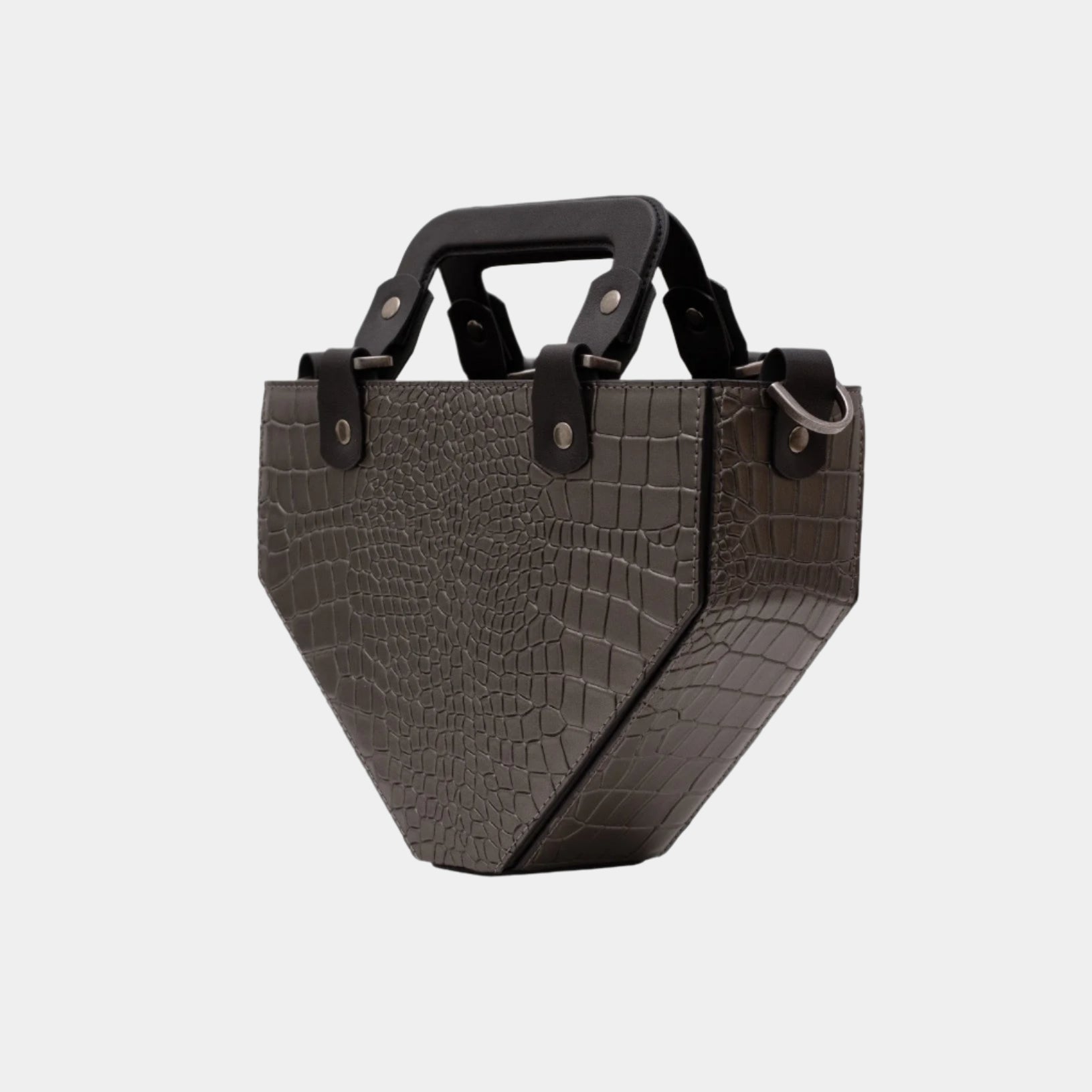 Side angle of Vio brown croc-textured leather handbag showing unique trapezoid silhouette