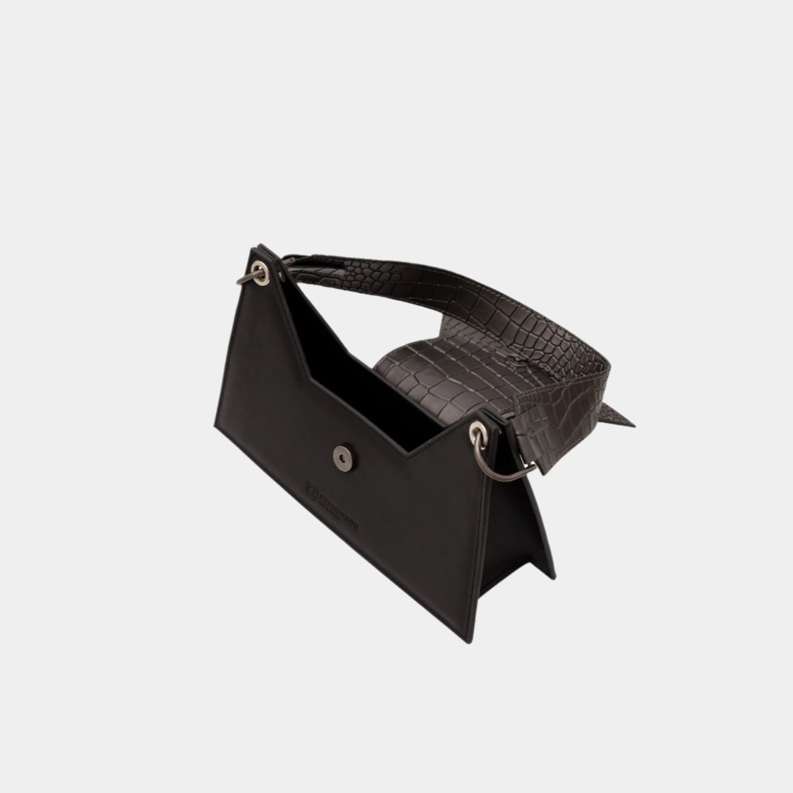 Open Kanna shoulder bag revealing spacious interior and metal clasp details