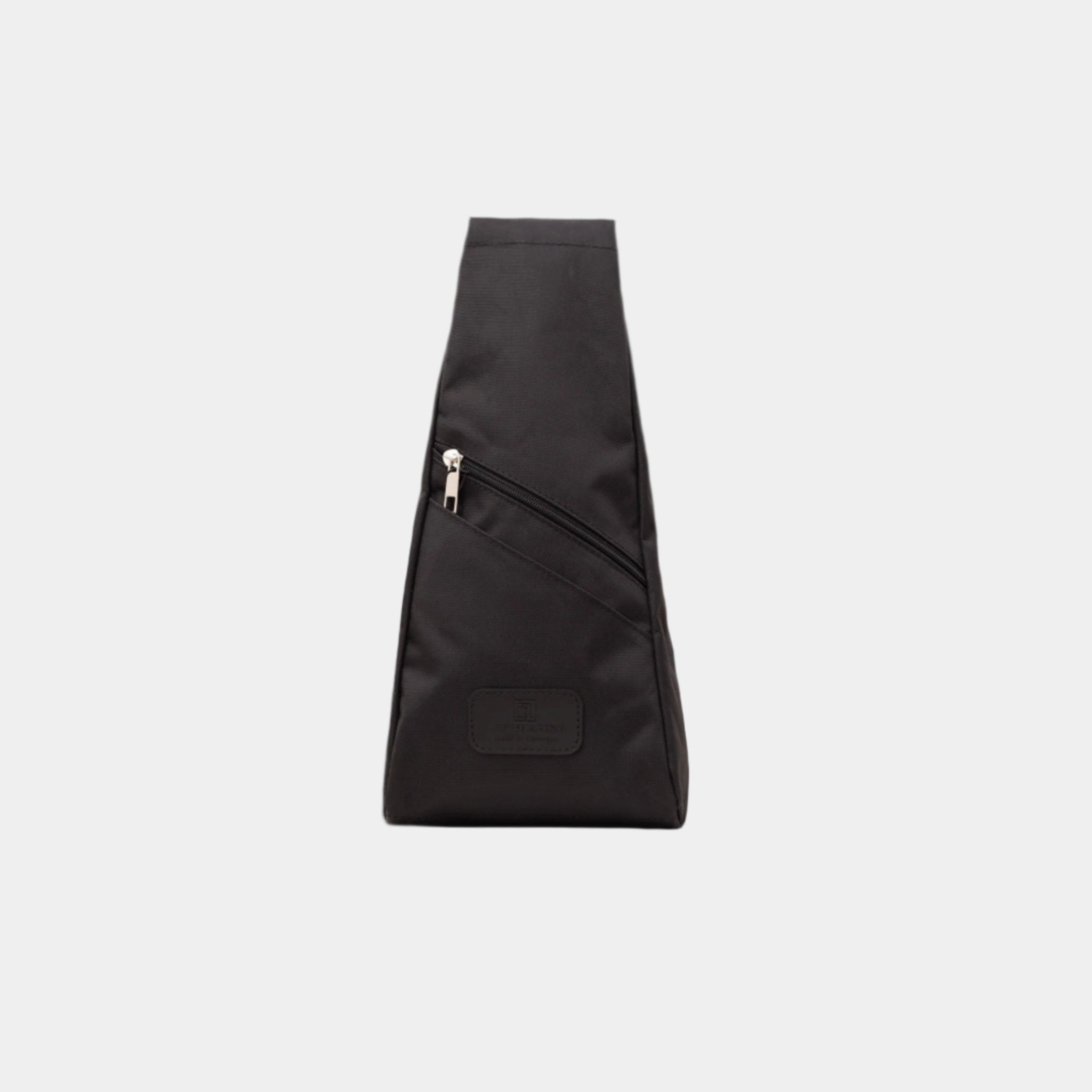 Front view of the River bag in black nylon with zipper detail and angled design.