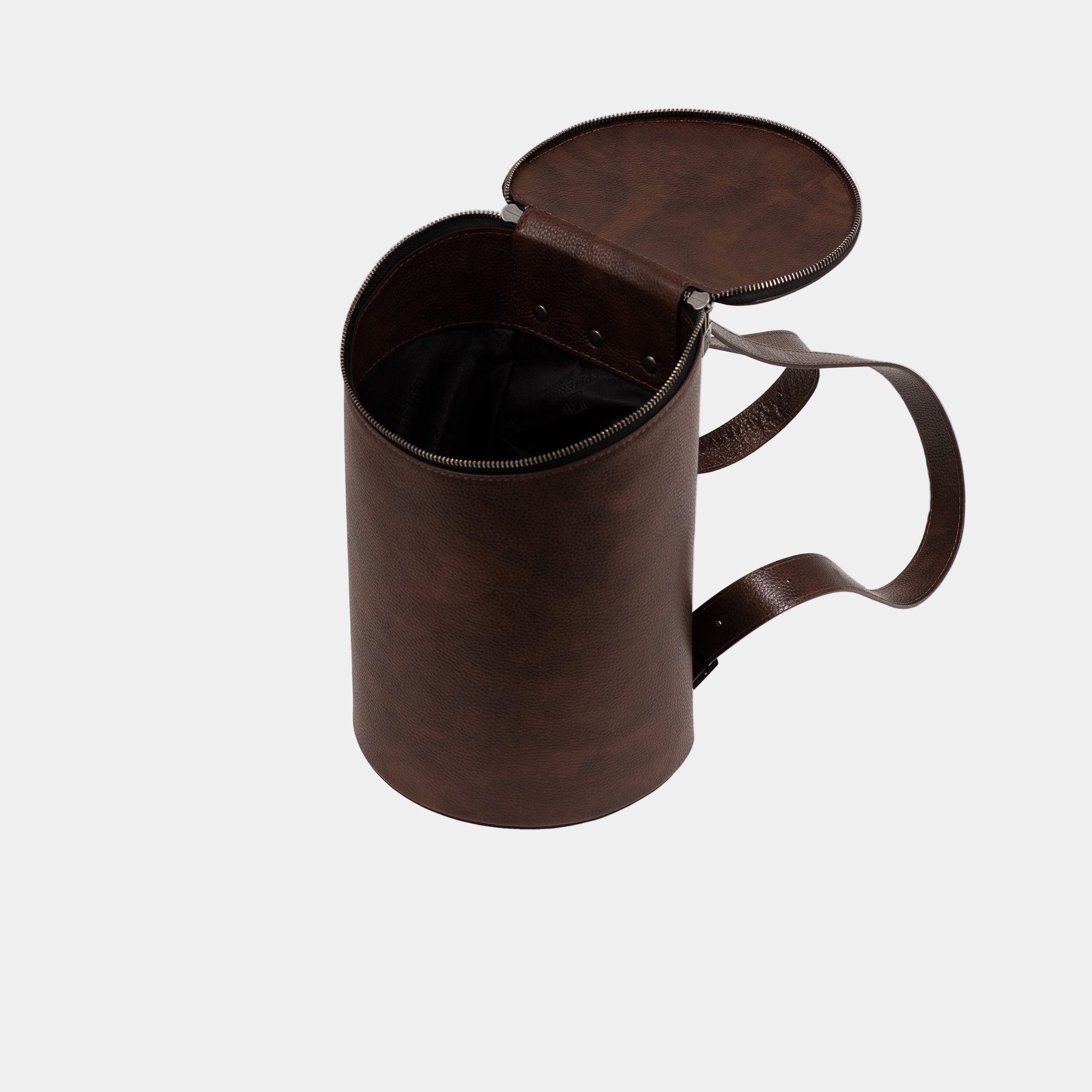 Frida backpack open – interior view showing single compartment and leather lining